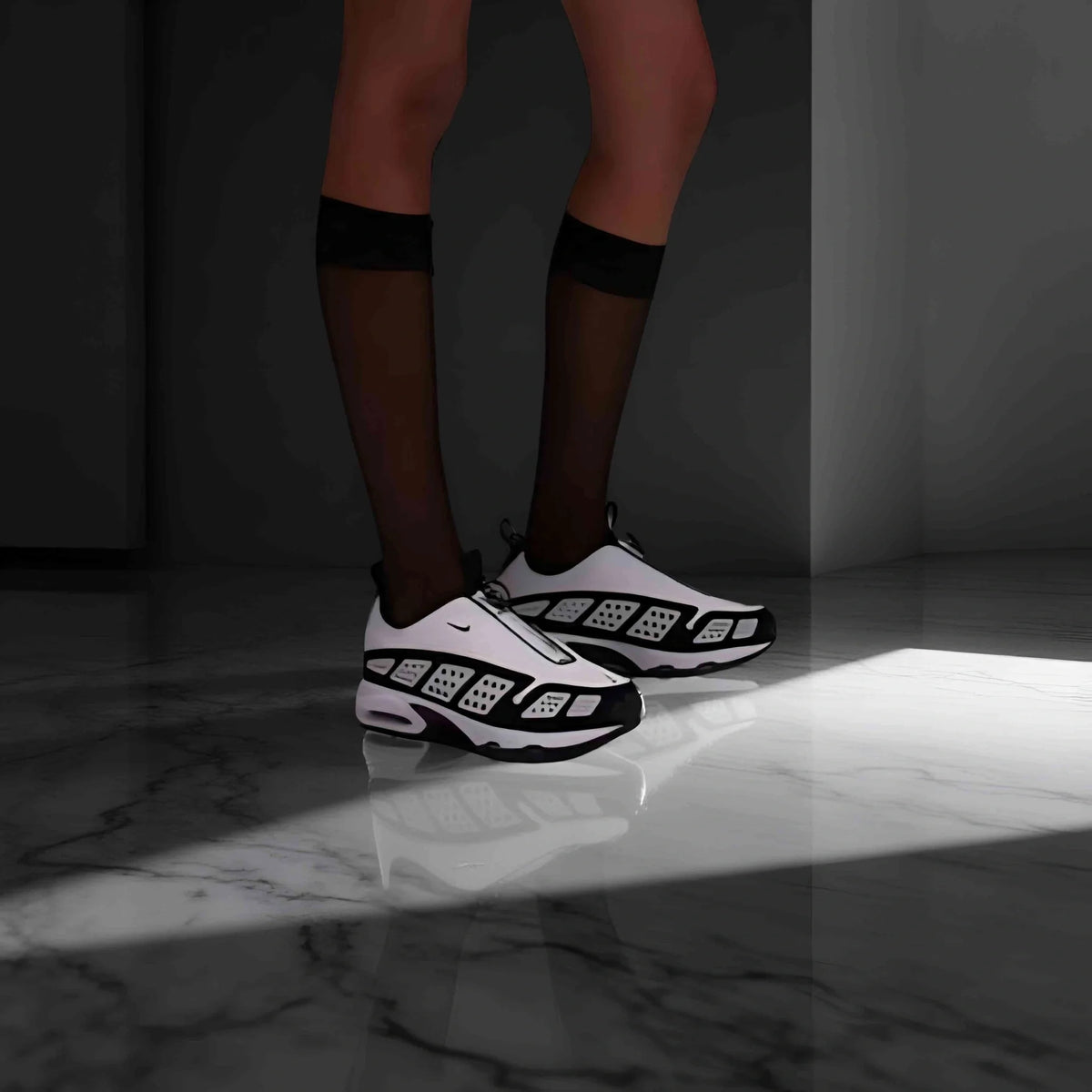 Air Max SNDR in white and black.