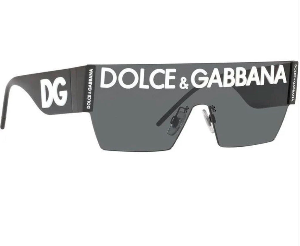 Dolce & Gabbana Shield Sunglasses: Dark shield-style sunglasses with prominent Dolce & Gabbana lettering across the brow