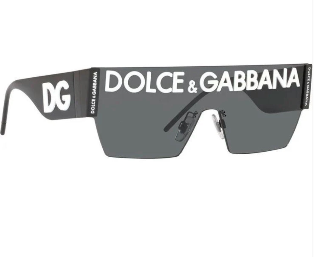 Dolce & Gabbana Shield Sunglasses: Dark shield-style sunglasses with prominent Dolce & Gabbana lettering across the brow