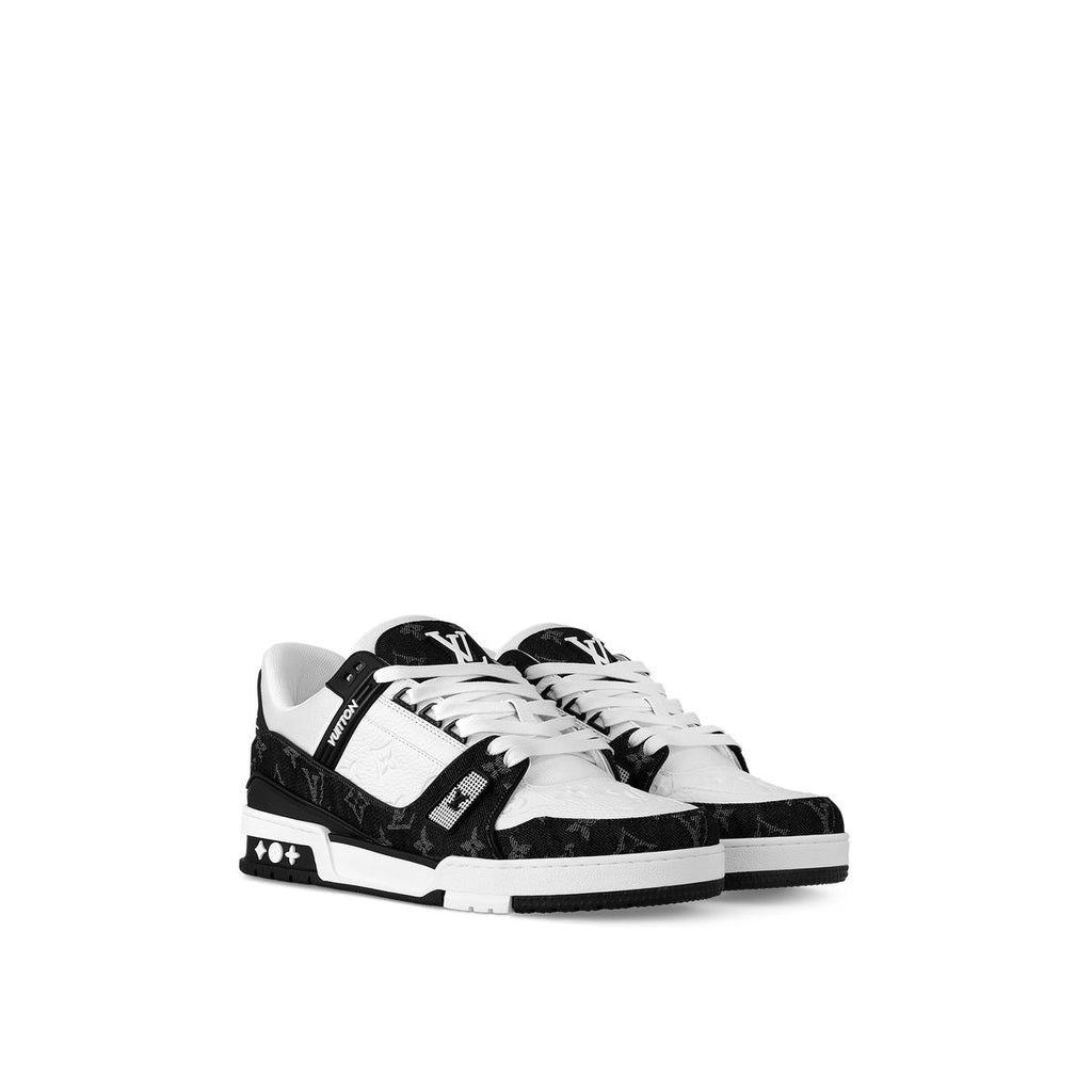 Pair of black and white Louis Vuitton Trainer sneakers with white laces, shown from the front and side.