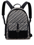 Dior Backpack: A black-and-grey patterned backpack with dark trim, a top handle and shoulder straps
