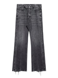 Balenciaga Lost Tape Jeans: Dark washed jeans with a wide-leg shape and raw-looking hems