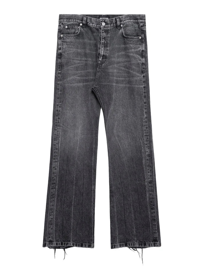 Balenciaga Lost Tape Jeans: Dark washed jeans with a wide-leg shape and raw-looking hems