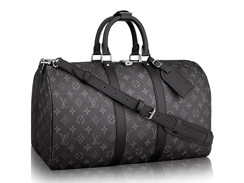 Louis Vuitton Monogram Duffel Bag: A dark monogram duffel with two top handles and a shoulder strap