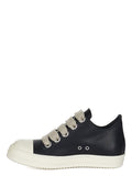 Rick Owens Low-Top Sneakers: Black low-top sneakers with large light-coloured laces, a contrasting toe cap and a light sole