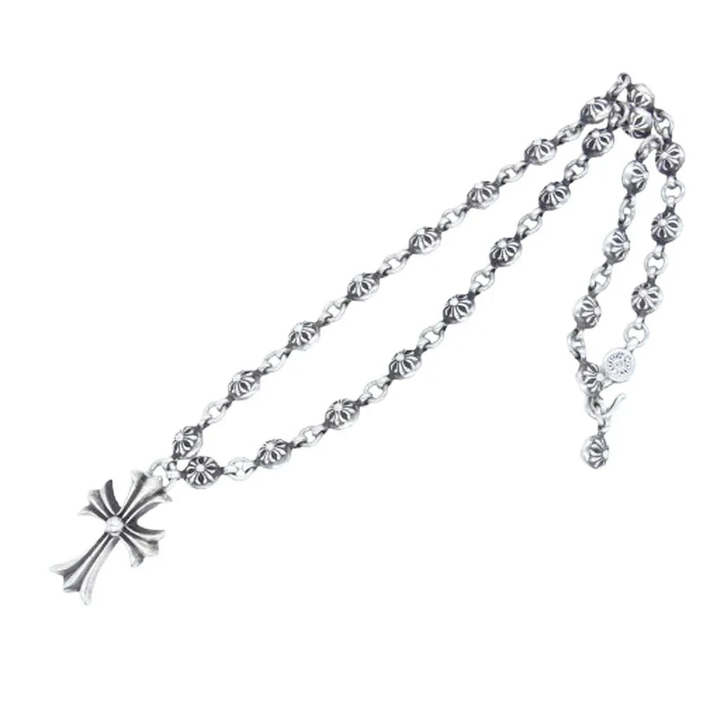 Chrome Hearts Cross Pendant Chain: A silver-tone chain with a cross-shaped pendant and decorative links