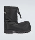 Balenciaga Alaska Boots: Dark boots with a tall, roomy shaft, side tie detail and a chunky treaded sole