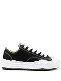 Maison Mihara MMY Sneakers: Black low-top sneakers with contrasting white laces, visible stitching and a sculpted white sole
