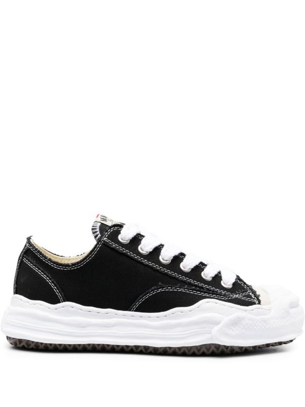 Maison Mihara MMY Sneakers: Black low-top sneakers with contrasting white laces, visible stitching and a sculpted white sole