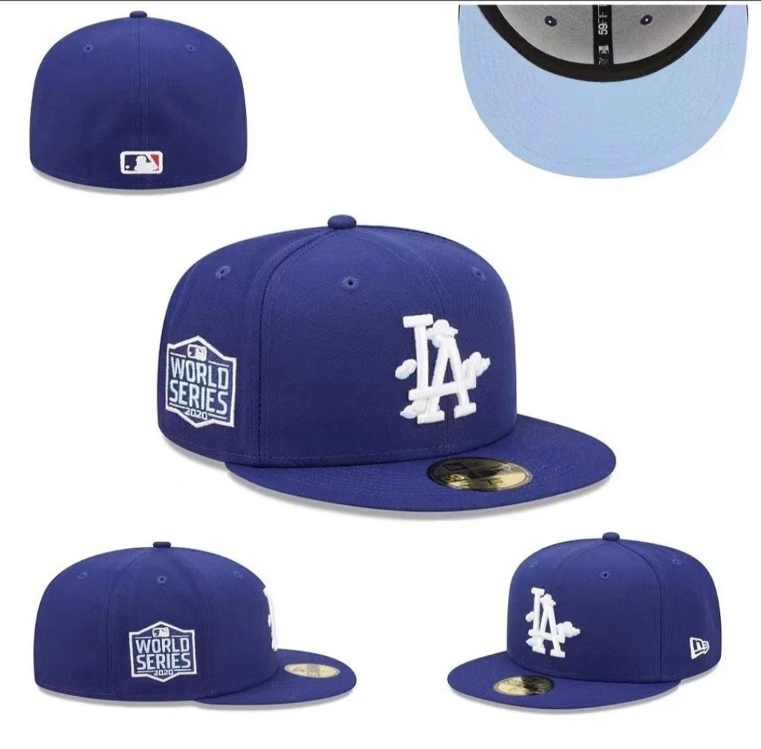 New Era LA Fitted Cap – Blue: A blue fitted cap with a white LA emblem and embroidered side patch